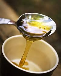 Honey poured into cup